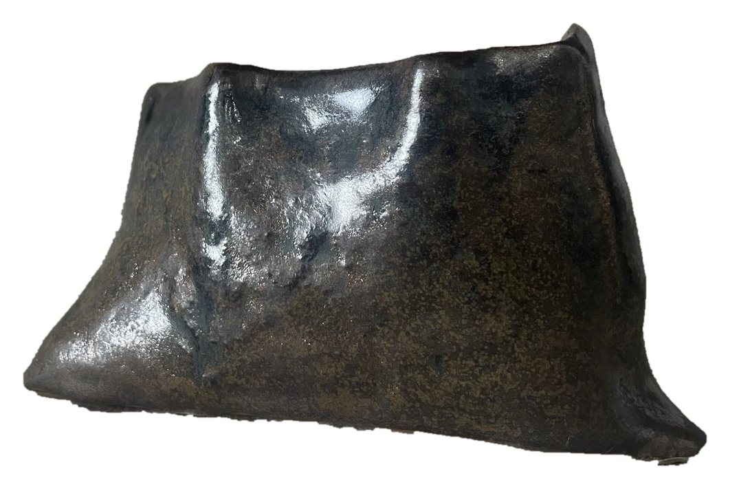 Low sculptural ceramic form with dark metallic glaze