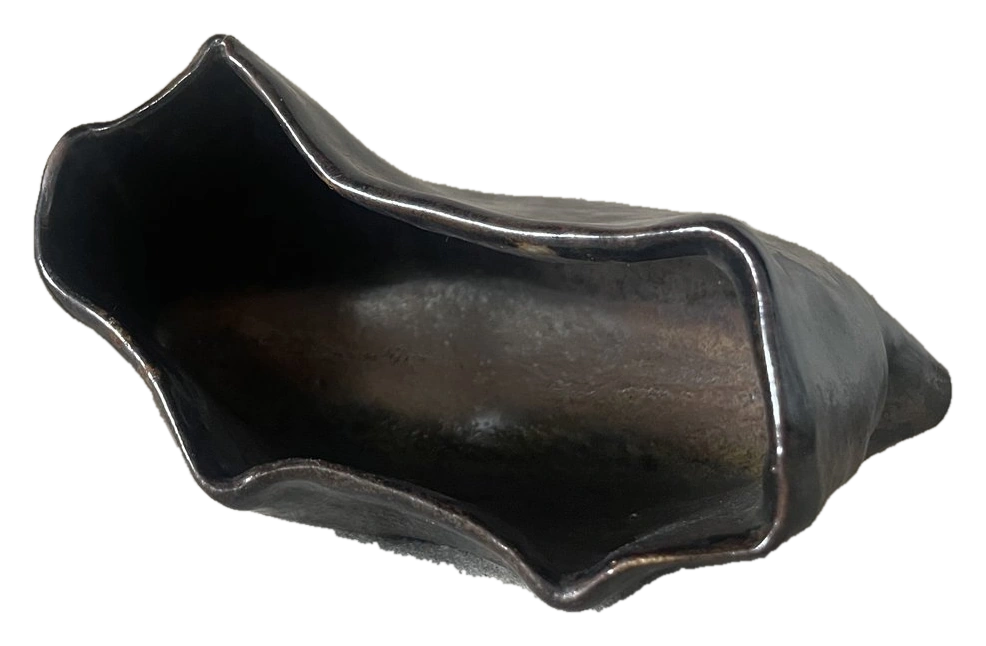 Open irregular vessel with a dark folded rim