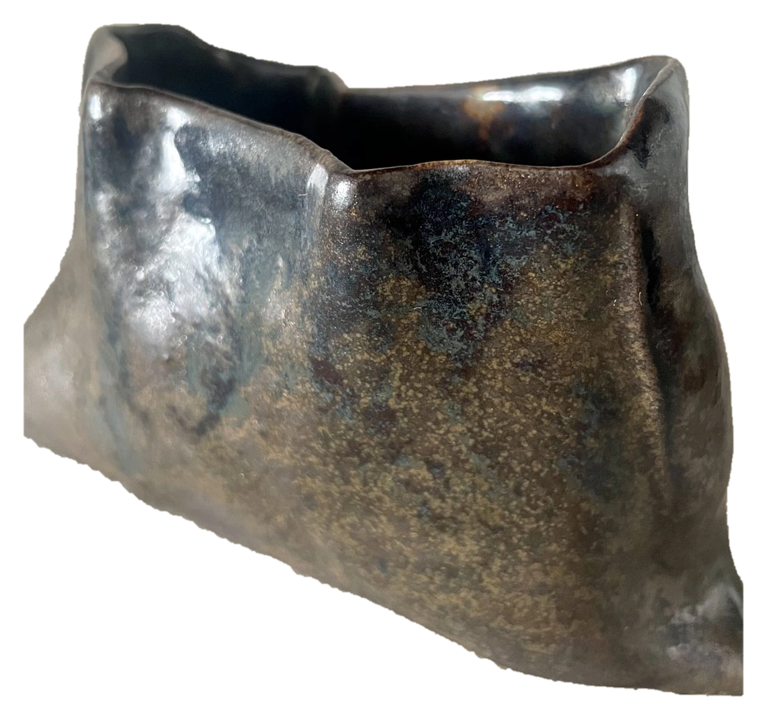 Upright asymmetric ceramic vessel with a glossy dark glaze