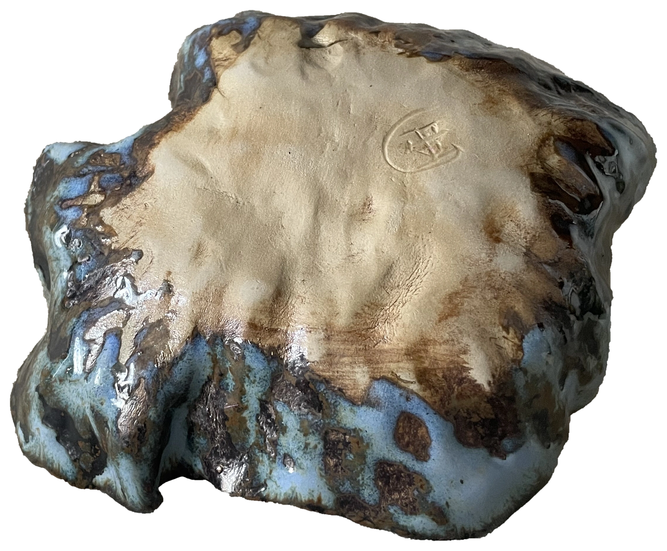 Underside of a rounded blue-glazed ceramic form