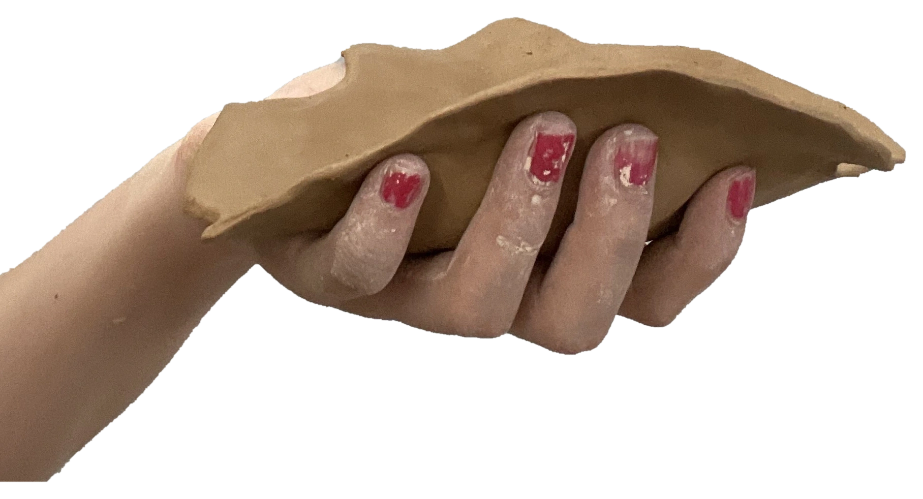 A hand and forearm holding a long unglazed ceramic form